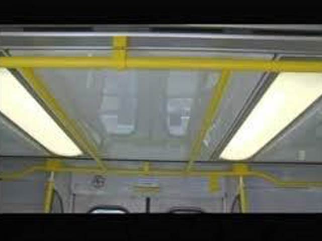 Closeup view of bus overhead handrails