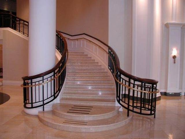 Dover Downs ornate curved staircase with metal banisters
